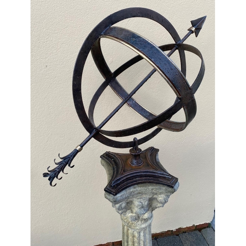 178 - A CAST IRON ARMILLARY SUN DIAL, sitting upon a Corinthian style column base. 148cm tall.