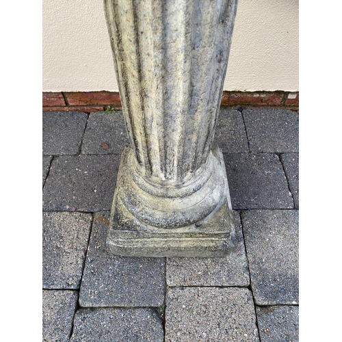 178 - A CAST IRON ARMILLARY SUN DIAL, sitting upon a Corinthian style column base. 148cm tall.