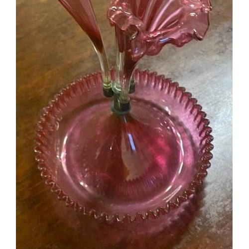 187 - A 19TH CENTURY CRANBERRY GLASS EPERGNE, consisting of four pinched floral shaped trumpet braches, th... 