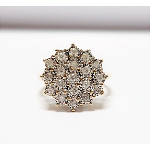 20 - A CHARMING 9CT YELLOW GOLD ILLUSION SET DIAMOND CLUSTER RING, the illusion setting helps to create a... 