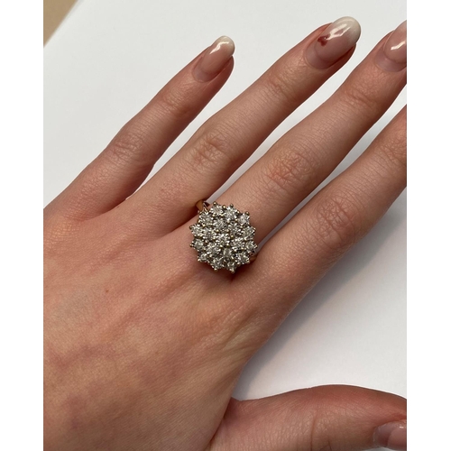 20 - A CHARMING 9CT YELLOW GOLD ILLUSION SET DIAMOND CLUSTER RING, the illusion setting helps to create a... 