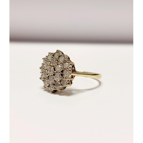 20 - A CHARMING 9CT YELLOW GOLD ILLUSION SET DIAMOND CLUSTER RING, the illusion setting helps to create a... 