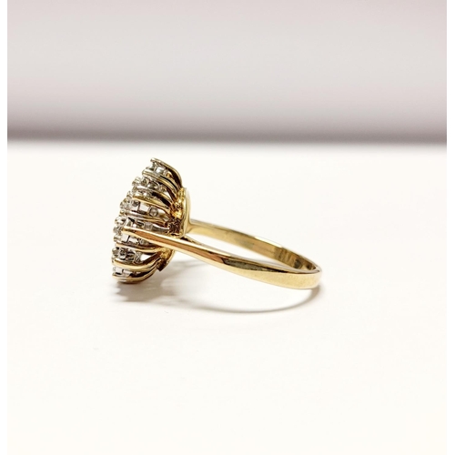 20 - A CHARMING 9CT YELLOW GOLD ILLUSION SET DIAMOND CLUSTER RING, the illusion setting helps to create a... 