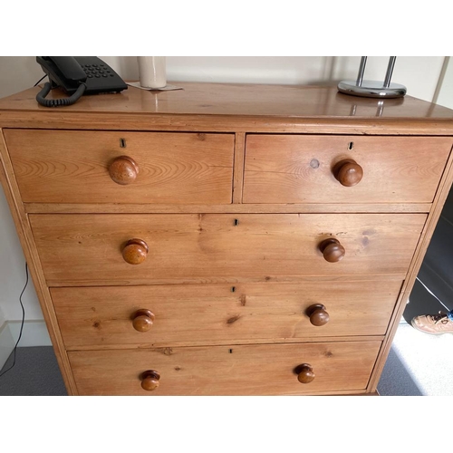 207 - A PINE FIVE DRAWER CHEST OF DRAWERS, on turned bun feet. Dimensions: 42in wide x 18in deep x 46in hi... 