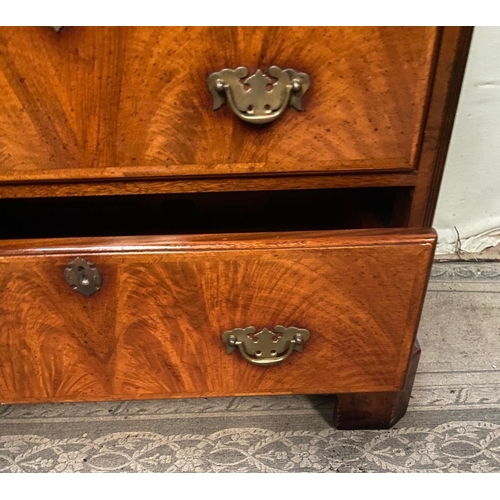 21 - AN ANTIQUE STYLE WALNUT DRINKS CABINET / MUSIC CABINET, the front has four faux drawers over a singl... 