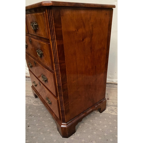 21 - AN ANTIQUE STYLE WALNUT DRINKS CABINET / MUSIC CABINET, the front has four faux drawers over a singl... 