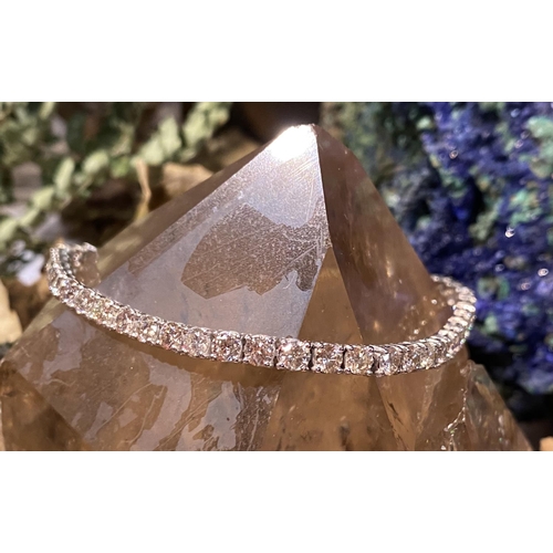 37 - A GORGEOUS 18CT WHITE GOLD DIAMOND TENNIS BRACELET, this is the gift of a lifetime! Be that for your... 