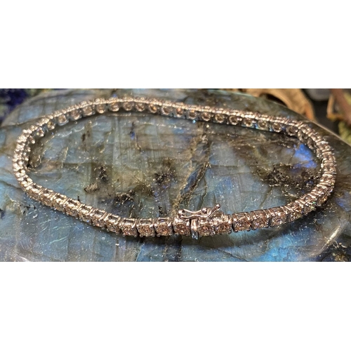 37 - A GORGEOUS 18CT WHITE GOLD DIAMOND TENNIS BRACELET, this is the gift of a lifetime! Be that for your... 