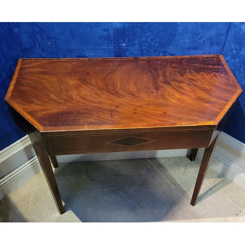 43 - AN IRISH GEORGIAN MAHOGANY & SATINWOOD INLAID FOLD OVER CARD TABLE, with canted front corners, the t... 