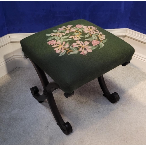 46 - A VERY FINE X-FRAME 19TH CENTURY FOOT STOOL, the top with embroided upholstery, the base made up of ... 