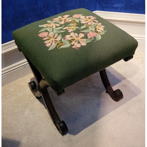 46 - A VERY FINE X-FRAME 19TH CENTURY FOOT STOOL, the top with embroided upholstery, the base made up of ... 