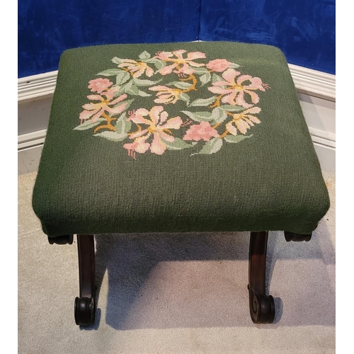 46 - A VERY FINE X-FRAME 19TH CENTURY FOOT STOOL, the top with embroided upholstery, the base made up of ... 