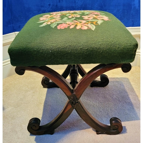 46 - A VERY FINE X-FRAME 19TH CENTURY FOOT STOOL, the top with embroided upholstery, the base made up of ... 