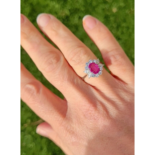 49 - A STUNNING 18CT WHITE GOLD BURMESE RUBY AND DIAMOND CLUSTER RING, beautiful oval cut Burmese ruby su... 