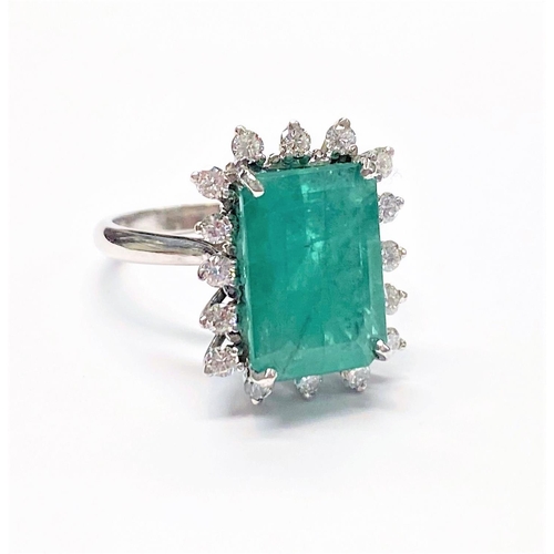 50 - A UNIQUE 18CT GOLD EMERALD AND DIAMOND CLUSTER RING, with beautiful 4.7ct central emerald surrounded... 