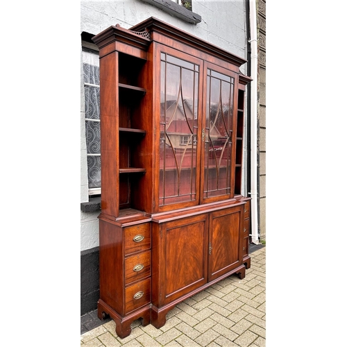 59 - AN IRISH GEROGIAN STYLE MAHOGANY BREAKFRONT LIBRARY BOOKCASE, a very fine piece of cabinetry with el... 