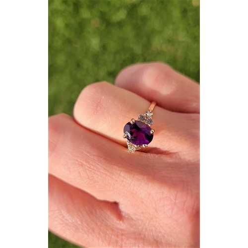 6 - A STUNNING 14CT YELLOW GOLD DIAMOND & AMETHYST RING, this pretty ring has a beautiful central oval s... 