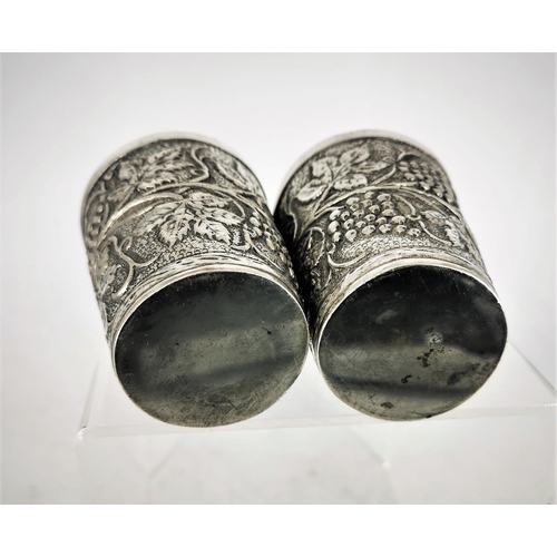 65 - TWO SILVER GRAPE VINE CUPS, each decorated all over with a grape and vine decoration, marked 800. Po... 