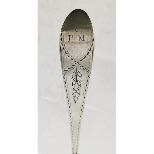 67 - AN IRISH 18TH CENTURY SILVER SERVING SPOON, decorated with fine bright cut decoration and monogram t... 