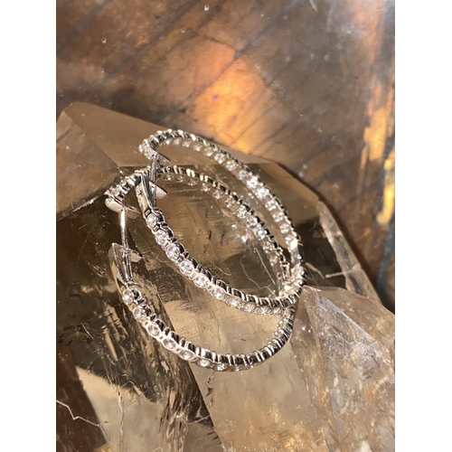 68 - A PAIR OF 18CT WHITE GOLD BEZEL SET DIAMOND HOOP EARRINGS, made up of approximately 2.59cts of Colou... 