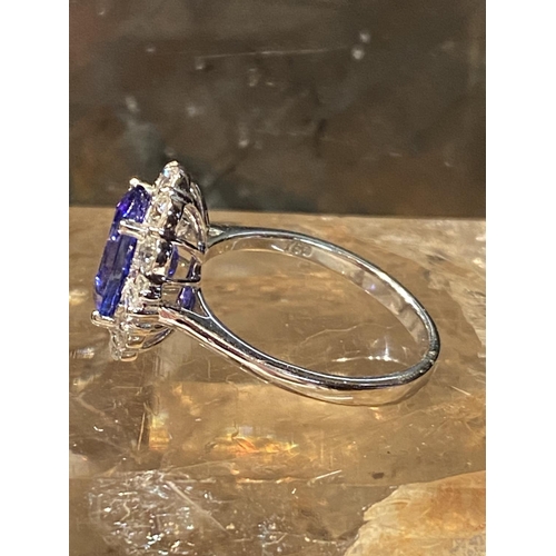 70 - A BEAUTIFUL 18CT WHITE GOLD SAPPHIRE & DIAMOND COCKTAIL RING, with wonderful central mixed cut oval ... 