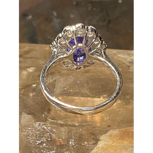 70 - A BEAUTIFUL 18CT WHITE GOLD SAPPHIRE & DIAMOND COCKTAIL RING, with wonderful central mixed cut oval ... 