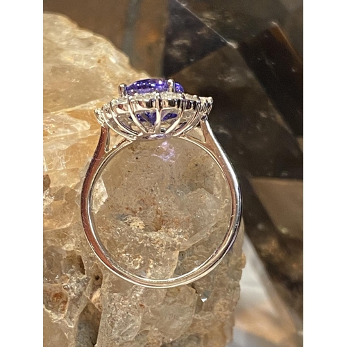 70 - A BEAUTIFUL 18CT WHITE GOLD SAPPHIRE & DIAMOND COCKTAIL RING, with wonderful central mixed cut oval ... 