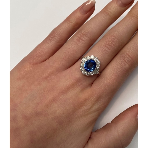 70 - A BEAUTIFUL 18CT WHITE GOLD SAPPHIRE & DIAMOND COCKTAIL RING, with wonderful central mixed cut oval ... 