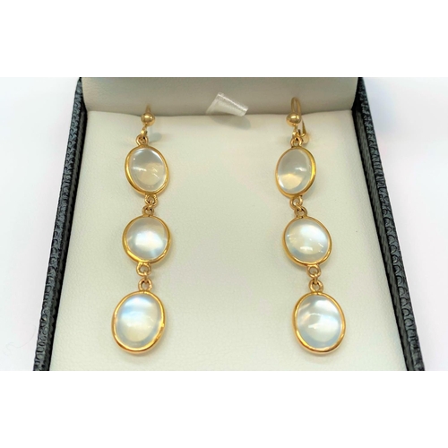 79 - A PAIR OF 14CT GOLD MOONSTONE DROP EARRINGS, featuring three moonstones each beautifully set in 14ct... 