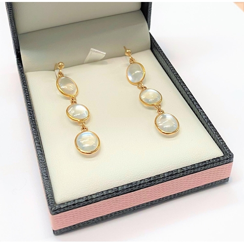 79 - A PAIR OF 14CT GOLD MOONSTONE DROP EARRINGS, featuring three moonstones each beautifully set in 14ct... 