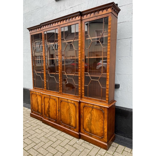 82 - A GOOD QUALITY BREAK-FRONT LIBRARY GLAZED BOOKCASE, to the top is a moulded dentil cornice with four... 