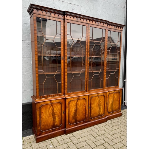 82 - A GOOD QUALITY BREAK-FRONT LIBRARY GLAZED BOOKCASE, to the top is a moulded dentil cornice with four... 