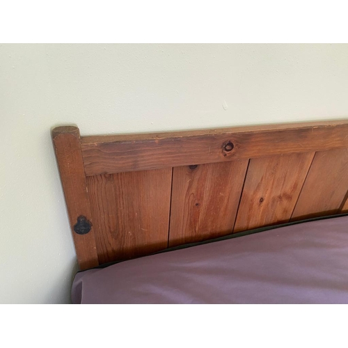 189 - A CLASSIC PINE WOOD PANELED HEADBOARD, along with mattress which sits on plywood base with 2 metal b... 