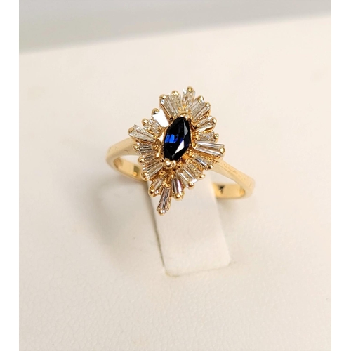 10 - A GLAMOUROUS 14CT YELLOW GOLD DIAMOND & SAPPHIRE ‘BALLERINA’ RING, the classic design of this ring i... 