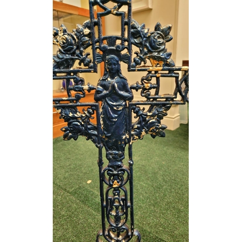 101 - A CAST IRON CRUCIFIX with floral decoration and image of Mary to the centre,35 inches tall x 20 inch... 