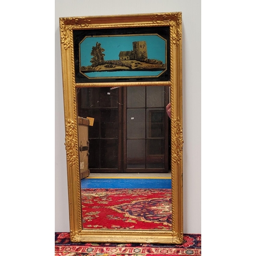 103 - AN ANTIQUE GILT PIER WALL MIRROR, 	with reverse painted picture panel to the top; showing a cottage ... 