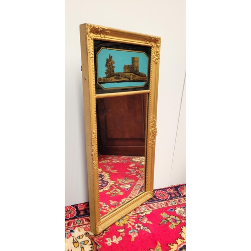 103 - AN ANTIQUE GILT PIER WALL MIRROR, 	with reverse painted picture panel to the top; showing a cottage ... 