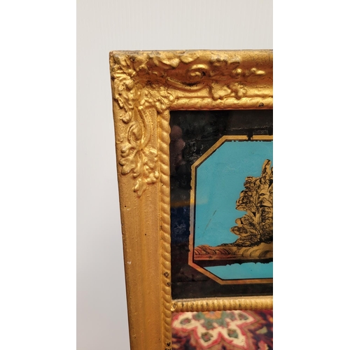 103 - AN ANTIQUE GILT PIER WALL MIRROR, 	with reverse painted picture panel to the top; showing a cottage ... 