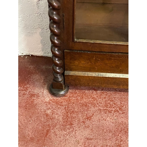 120 - A 19TH CENTURY IRISH OAK TWO DOOR GLAZED CABINET, with a tapered pediment over a line of bold dentil... 