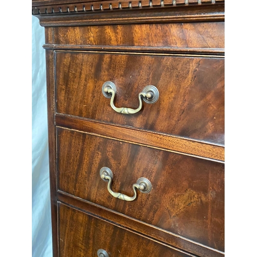 128 - A GEORGIAN STYLE MAHOGANY CHEST ON CHEST, with moulded dentil cornice to the top over eight drawers;... 