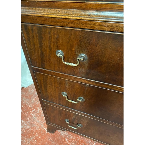 128 - A GEORGIAN STYLE MAHOGANY CHEST ON CHEST, with moulded dentil cornice to the top over eight drawers;... 