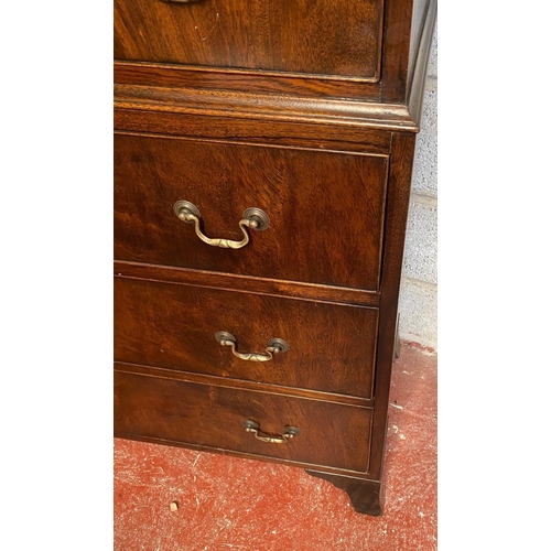 128 - A GEORGIAN STYLE MAHOGANY CHEST ON CHEST, with moulded dentil cornice to the top over eight drawers;... 