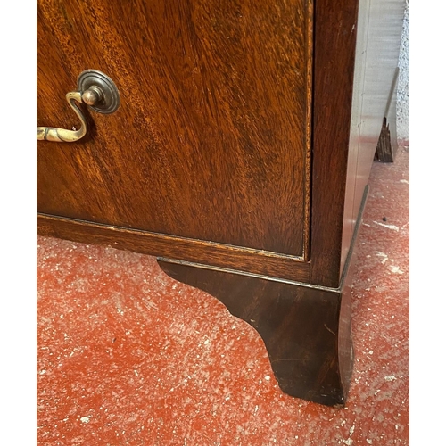 128 - A GEORGIAN STYLE MAHOGANY CHEST ON CHEST, with moulded dentil cornice to the top over eight drawers;... 