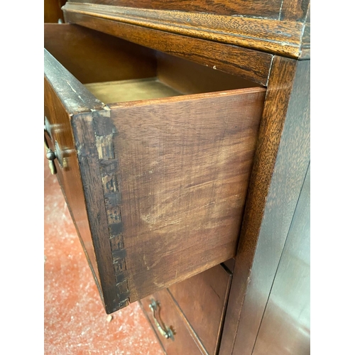 128 - A GEORGIAN STYLE MAHOGANY CHEST ON CHEST, with moulded dentil cornice to the top over eight drawers;... 