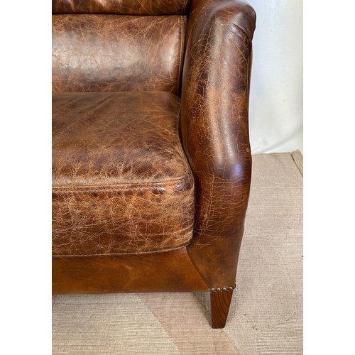 13 - A GOOD QUALITY PAIR OF TAN LEATHER WINGBACK ARMCHAIRS. Dimensions: 71cm x 76cm x 96cm approx.