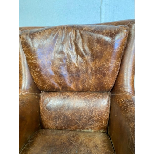 13 - A GOOD QUALITY PAIR OF TAN LEATHER WINGBACK ARMCHAIRS. Dimensions: 71cm x 76cm x 96cm approx.