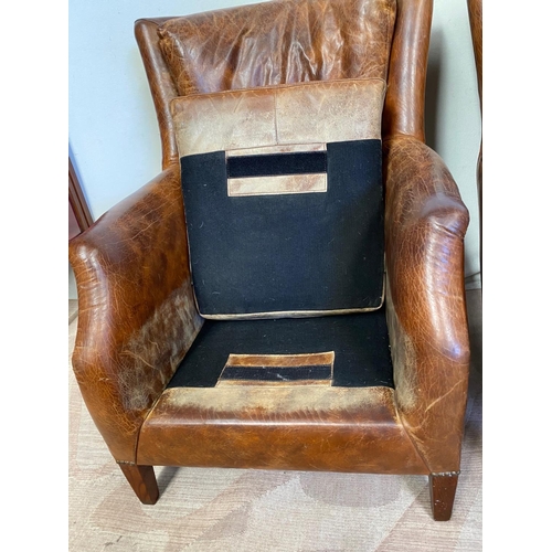 13 - A GOOD QUALITY PAIR OF TAN LEATHER WINGBACK ARMCHAIRS. Dimensions: 71cm x 76cm x 96cm approx.