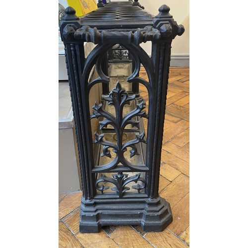 130 - A GOTHIC DESIGN CAST IRON COALBROOKDALE STYLE DOUBLE UMBRELLA STAND, of rectangular form, the platea... 