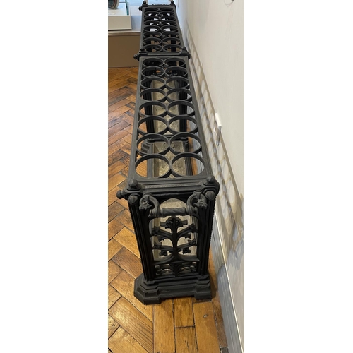 130 - A GOTHIC DESIGN CAST IRON COALBROOKDALE STYLE DOUBLE UMBRELLA STAND, of rectangular form, the platea... 