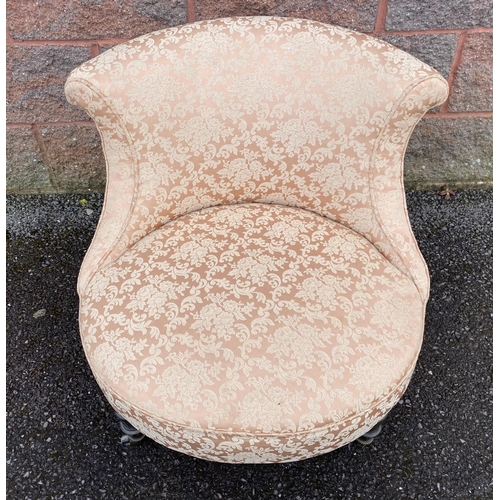 132 - A 19TH CENTURY CIRCULAR UPHOLSTERED NURSING CHAIR, on turned leg with castors, Dimensions: 64cm high... 